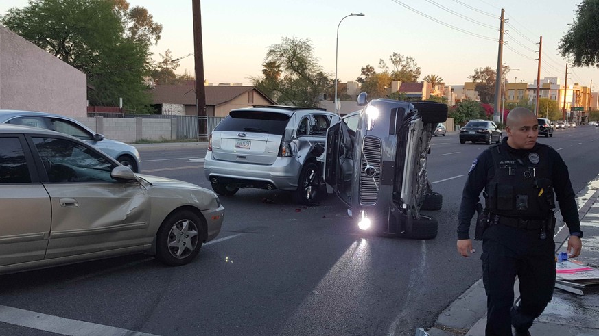 A self-driven Volvo SUV owned and operated by Uber Technologies Inc. is flipped on its side after a collision in Tempe, Arizona, U.S. on March 24, 2017. Picture taken on March 24, 2017. Courtesy FRESC ...