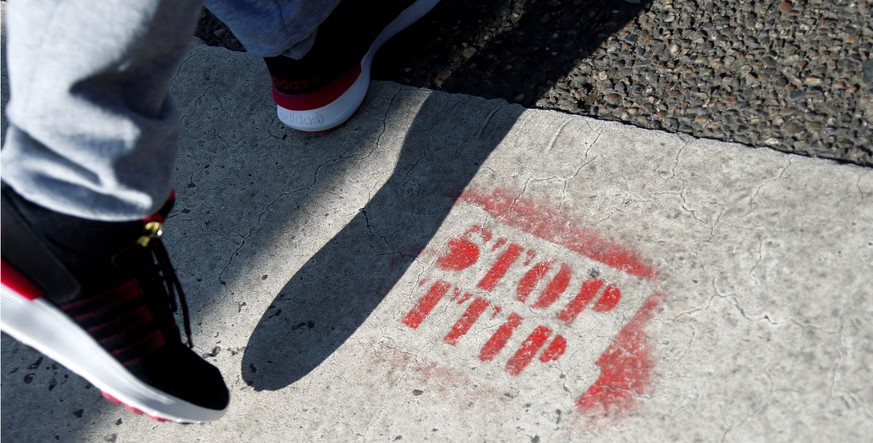 A sprayed sign against the Transatlantic Trade and Investment Partnership (TTIP) free trade agreement is pictured in Frankfurt, Germany, March 29, 2016. Picture taken March 29, 2016. REUTERS/Ralph Orl ...