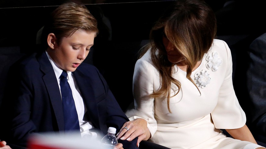 Son of Republican presidential candidate Donald Trump, Barron Trump (L) and mother Melania Trump speak at the Republican National Convention in Cleveland, U.S., July 21, 2016. REUTERS/Carlo Allegri