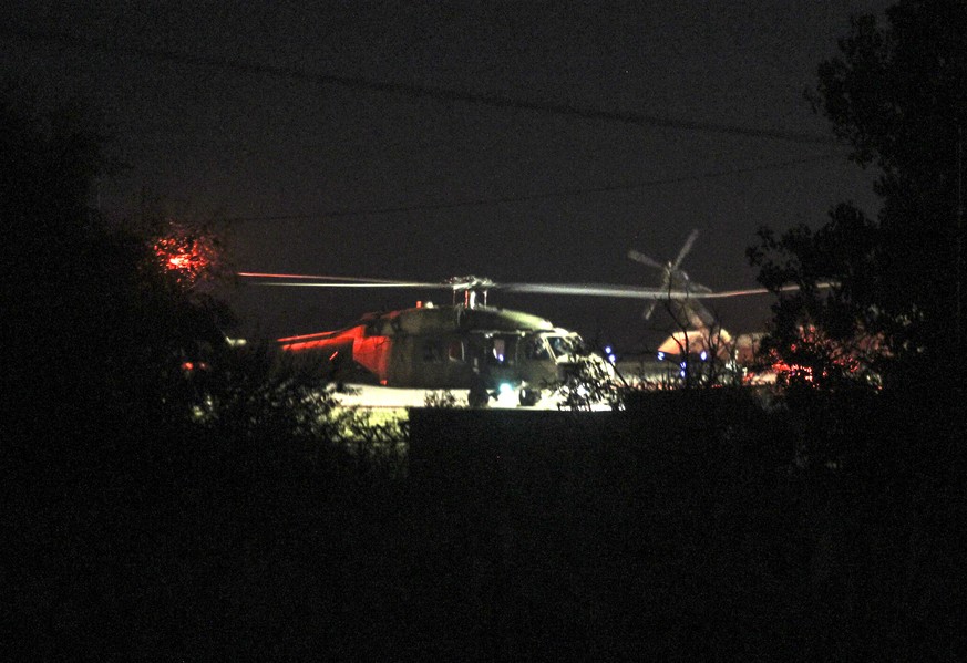 A Turkish Blackhawk helicopter sits on the tarmac of the airport of Alexandroupolis, northern Greece, Sunday, July 17, 2016. The Greek government said a Turkish Blackhawk helicopter will be returned t ...