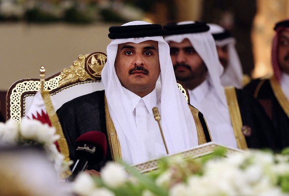 FILE- In this Tuesday, Dec. 9, 2014 file photo, Qatar&#039;s Emir Sheikh Tamim bin Hamad Al-Thani attends a Gulf Cooperation Council summit in Doha, Qatar. Bahrain says it is cutting diplomatic ties t ...