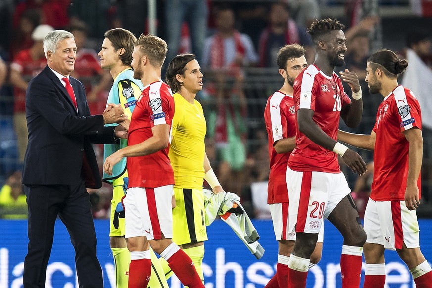 epa05527773 Swiss head coach Vladimir Petkovic (L) celebrates with his players after the FIFA World Cup 2018 group B qualifying soccer match between Switzerland and Portugal at the St. Jakob-Park stad ...