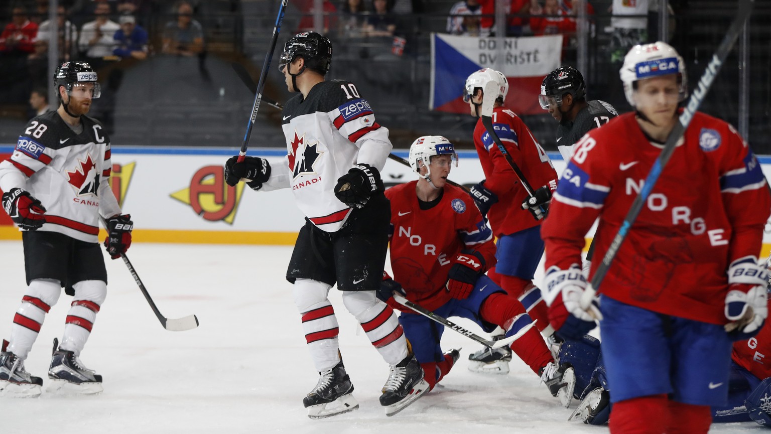 Canada&#039;s Brayden Schenn, 2nd left, celebrates with teammate Canada&#039;s Claude Giroux, left, after scoring his sides first goal during the Ice Hockey World Championships group B match between C ...