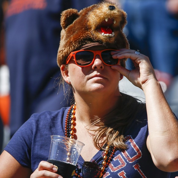 epa04389718 A Chicago Bears fan is decked out in her bear hat before the start of the NFL American football game between the Buffalo Bills and the Chicago Bears at Soldier Field in Chicago, Illinois,  ...