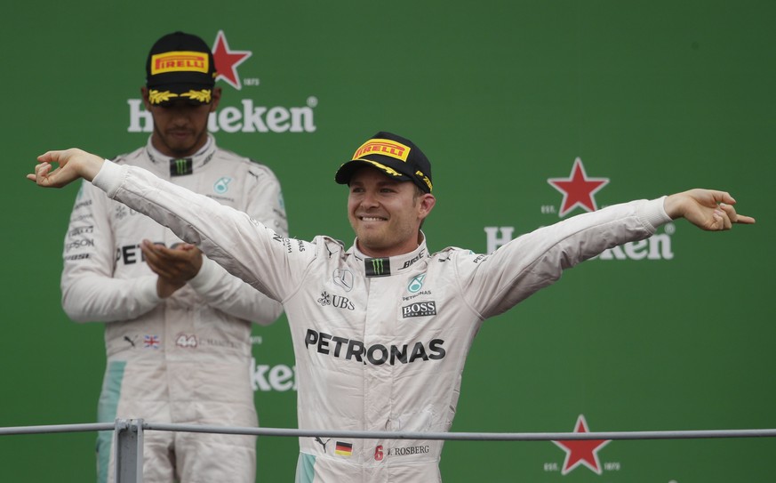 Formula One - F1 - Italian Grand Prix 2016 - Autodromo Nazionale Monza, Monza, Italy - 4/9/16
Mercedes&#039; Nico Rosberg celebrates his win on the podium after the race as Lewis Hamilton looks on
R ...