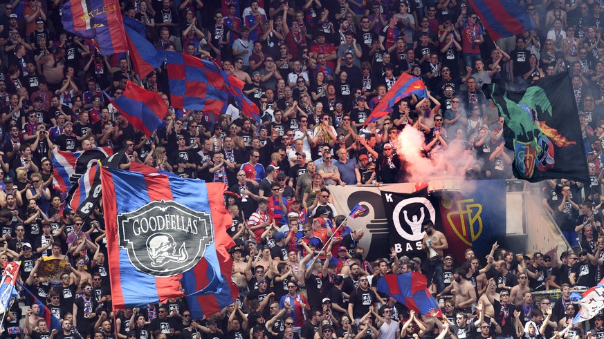FC Basel supporters light a flare during the the Swiss Cup final soccer match between FC Basel 1893 and FC Sion at the stade de Geneve stadium, in Geneva, Switzerland, Thursday, May 25, 2017. (KEYSTON ...