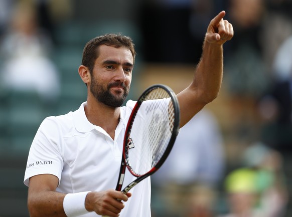 epa06083366 Marin Cilic of Croatia celebrates his win over Gilles Muller of Luxembourg in their quarter final match during the Wimbledon Championships at the All England Lawn Tennis Club, in London, B ...