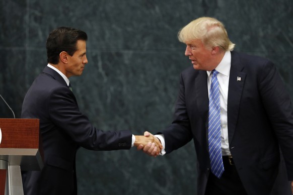 Mexico President Enrique Pena Nieto and Republican presidential nominee Donald Trump shake hands after a joint statement at Los Pinos, the presidential official residence, in Mexico City, Wednesday, A ...