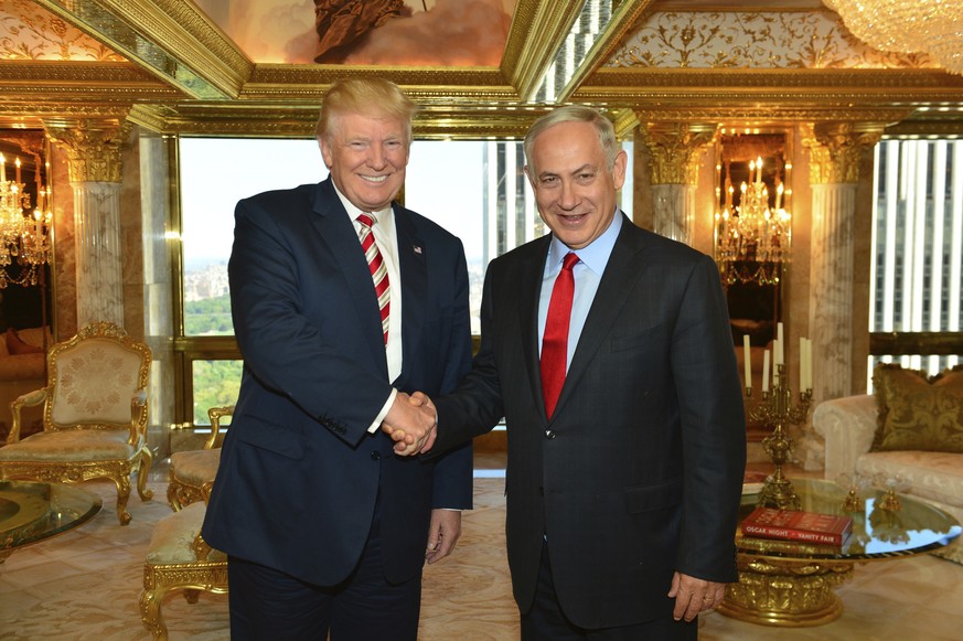 In this handout photo made on Sunday, Sept. 25, 2016, provided by the Israeli Government Press Office, Republican Presidential candidate Donald Trump shakes hand with Israeli Prime Minister Benjamin N ...