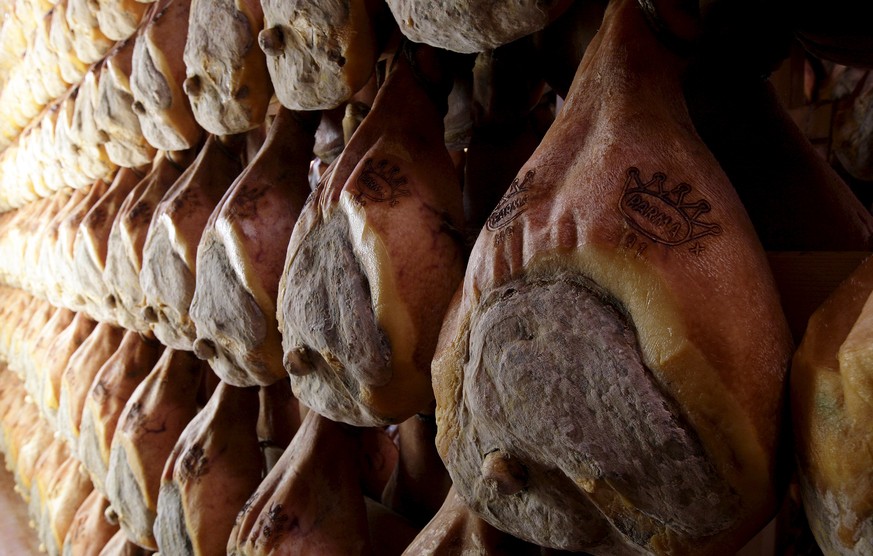 Lines of Parma ham are hung to dry in a special room in Langhirano, near Parma, in this October 13, 2009 file photo. The home of Parma ham, trumpeting the benefits of a traditional Mediterranean diet, ...