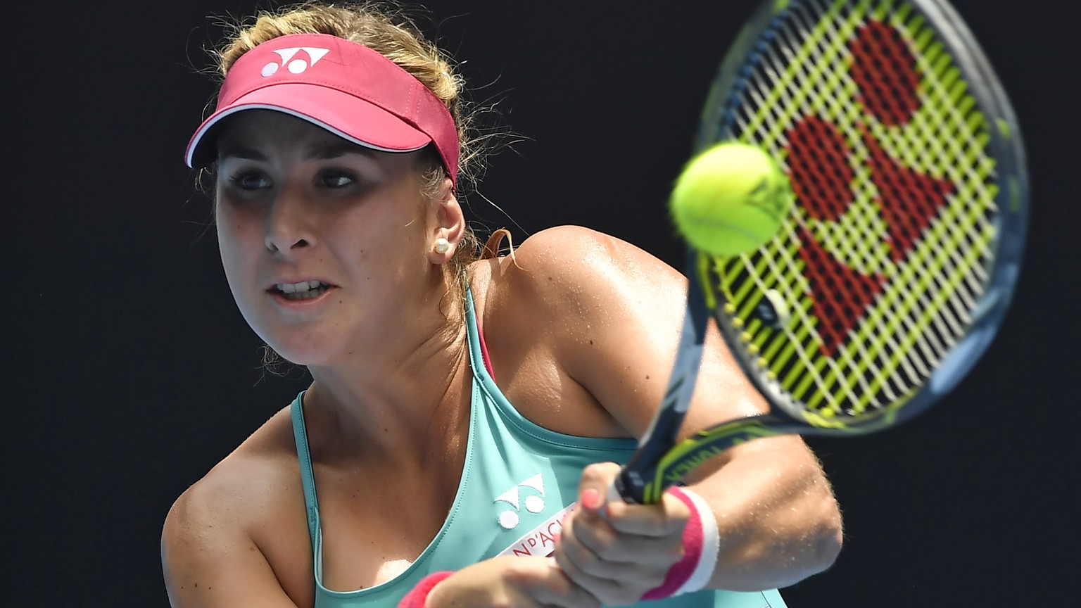 Switzerland&#039;s Belinda Bencic makes a backhand return to United States&#039; Serena Williams during their first round match at the Australian Open tennis championships in Melbourne, Australia, Tue ...