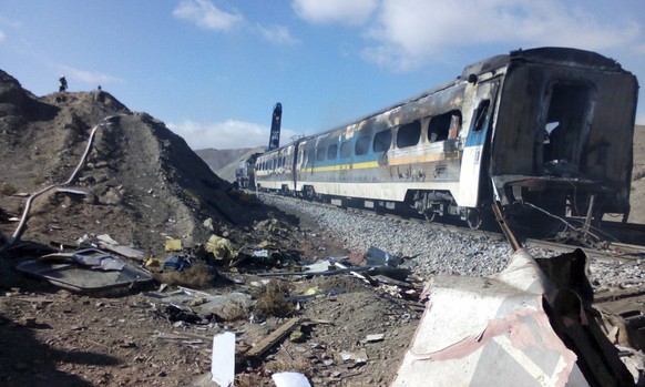 This picture released by Iranian Fars News Agency shows the scene of two trains collision about 150 miles (250 kilometers) east of the capital Tehran, Iran, Friday, Nov. 25, 2016. An Iranian official  ...