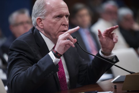 epa05984056 Former CIA Director John Brennan testifies before the House Intelligence Committee hearing on the investigation about Russian interference in the 2016 presidential campaign on Capitol Hill ...