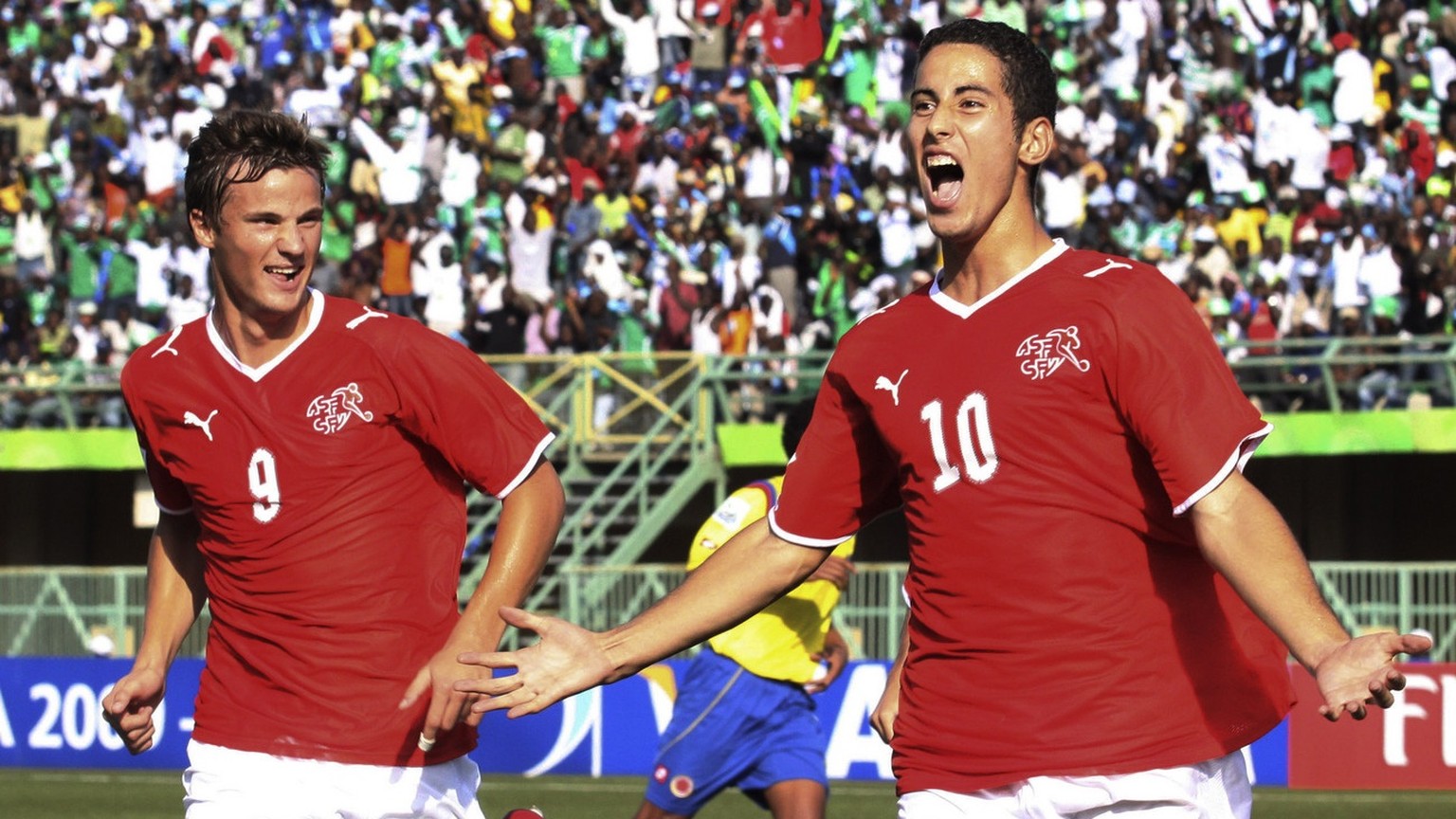 Switzerland&#039;s Nassim Ben Khalifa, right, reacts with fellow team member Haris Seferovic, left, after scoring on a penalty kick against Colombia during their Under-17 World Cup semifinal soccer ma ...