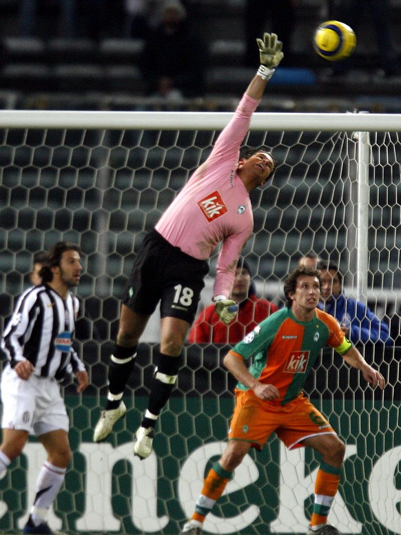 Bremen&#039;s goalie Tim Wiese saves on a headshot by Juventus&#039; defender Fabio Cannavaro, right, during their Uefa Champions League eightfinal second leg soccer match against Juventus at the Dell ...