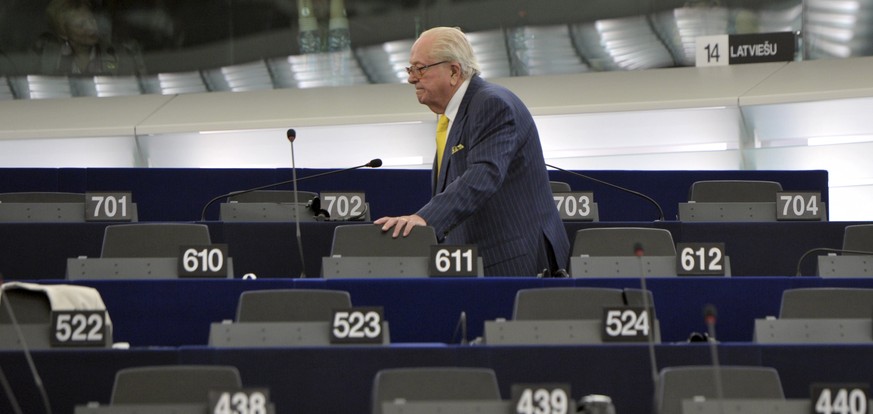 FILE - In this July 1, 2014 file photo, French former far right National Front leader Jean Marie Le Pen looks for his seat at the European Parliament, in Strasbourg, eastern France. A pact of sorts ma ...