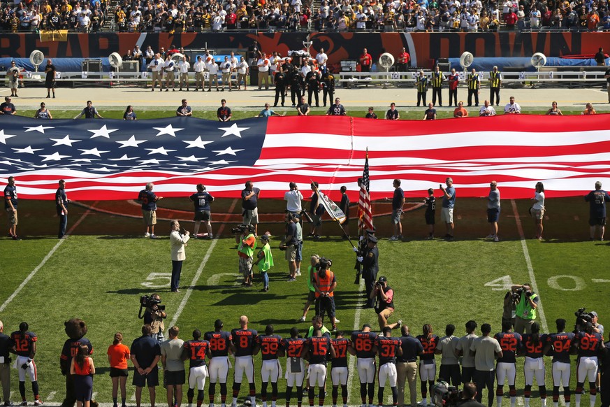 The Pittsburgh Steelers side of the field is nearly empty during the playing of the national anthem before an NFL football game between the Steelers and Chicago Bears, Sunday, Sept. 24, 2017, in Chica ...