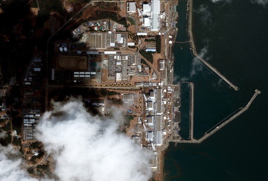 This satellite image provided by Maxar Technologies shows overview of Fukushima Daiichi nuclear power plant in Okuma, Fukushima prefecture, Japan after an earthquake and tsunami on March 12, 2011. Jap ...