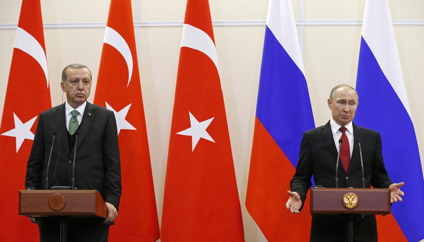 Russian President Vladimir Putin, right, and Turkish President Recep Tayyip Erdogan attend a news conference following their talks in Putin&#039;s residence in the Russian Black Sea resort of Sochi, R ...
