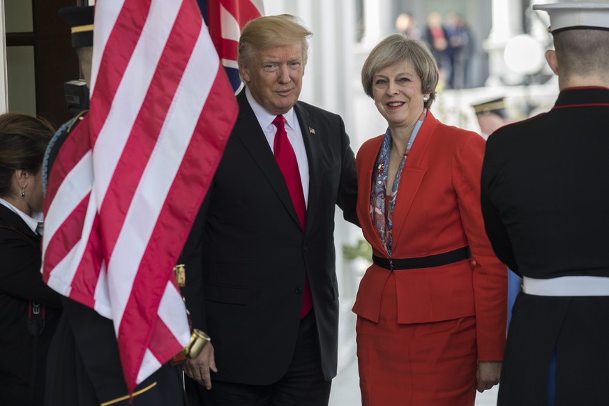 epa05754983 US President Donald J. Trump greets British Prime Minister Theresa May as she arrives at the White House in Washington, DC, USA, 27 January 2017. Prime Minister May is the first foreign he ...
