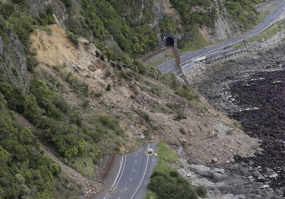 A landslide blocks State Highway One and the main railway line north of Kaikoura following an earthquake in New Zealand, Monday, Nov. 14, 2016. A powerful earthquake that rocked New Zealand on Monday  ...