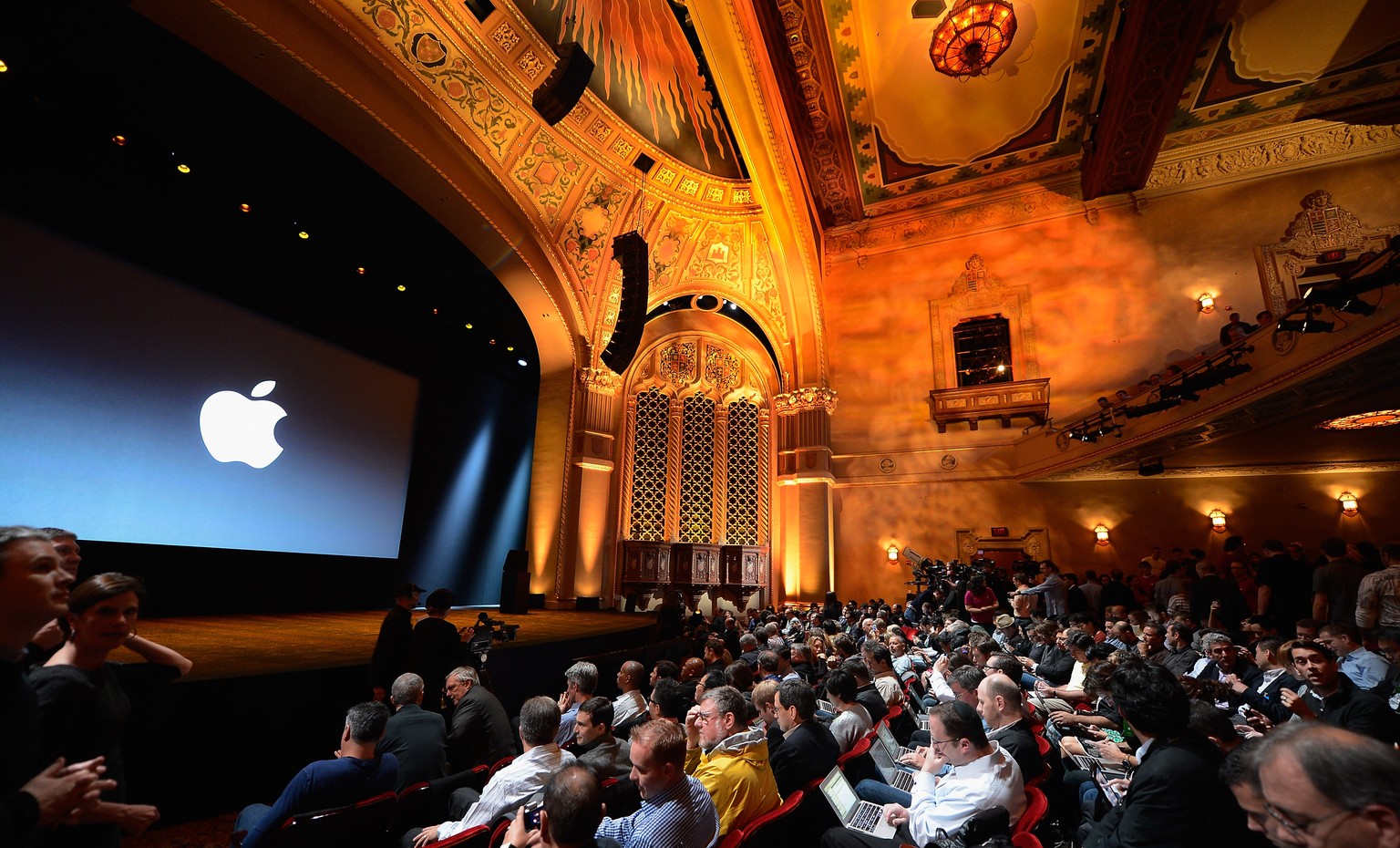 SAN JOSE, CA - OCTOBER 23: Tech reporters, bloggers and members of the news media wait for the start of an Apple special event at the historic California Theater on October 23, 2012 in San Jose, Calif ...