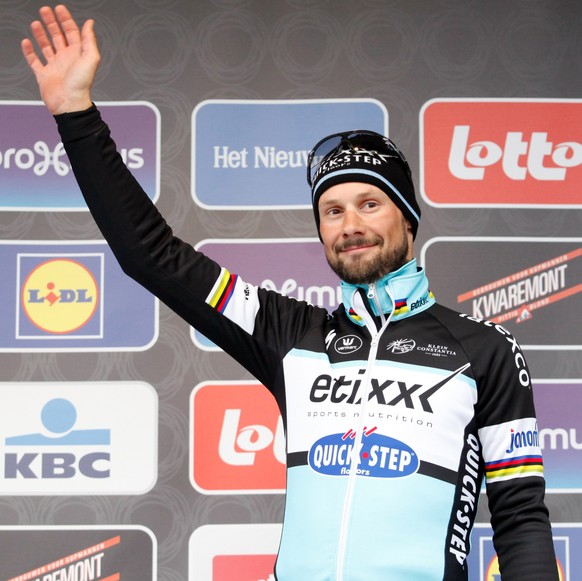 Tom Boonen waves on podium at the 70th edition of the Omloop Het Nieuwsblad cycling event in Ghent, Belgium on Saturday, Feb. 28, 2015. Ian Stannard of team Sky win the race, Niki Terpstra of the Etix ...