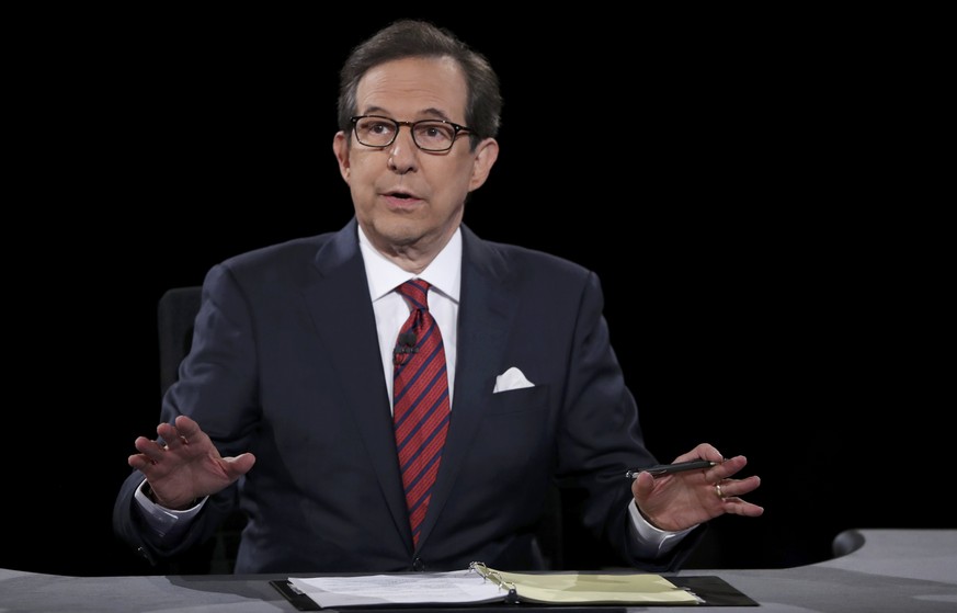 Debate moderator Chris Wallace speaks to Republican U.S. presidential nominee Donald Trump and Democratic nominee Hillary Clinton during their third and final 2016 presidential campaign debate at UNLV ...