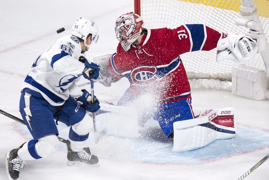 Montreal Canadiens goalie Carey Price (31) makes a save off Tampa Bay Lightning&#039;s Yanni Gourde during first-period NHL hockey action in Montreal,Friday, April 7, 2017. (Paul Chiasson/The Canadian ...