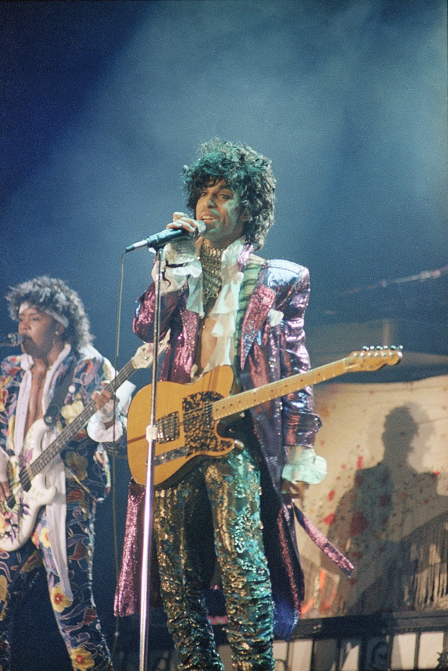 FILE - In this 1985 file photo, singer Prince performs in concert. As the one-year anniversary of Prince’s death approaches, his 1980s band The Revolution is back together and kicking off a three-mont ...