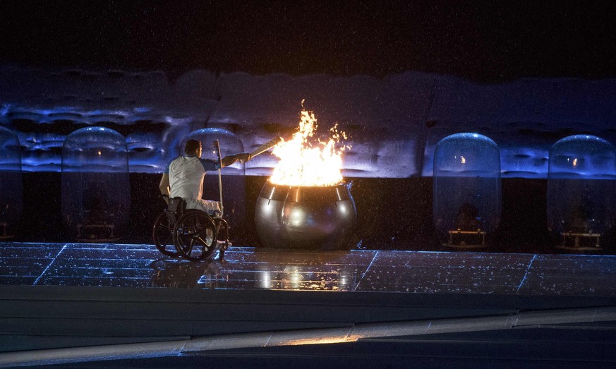 2016 Rio Paralympics - Opening ceremony - Maracana - Rio de Janeiro, Brazil - 07/09/2016. Brazilian Paralympic swimmer Clodoaldo Silva lights the flame during the opening ceremony. REUTERS/Pool FOR ED ...