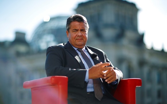German Economy Minister Sigmar Gabriel arrives for a television interview in front of the Reichstag building in Berlin, Germany, August 7, 2016. REUTERS/Hannibal Hanschke