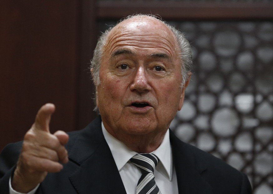 FIFA President Sepp Blatter gestures as he meets Palestinian President Mahmoud Abbas in the West Bank city of Ramallah May 26, 2014. REUTERS/Mohamad Torokman (WEST BANK - Tags: POLITICS SPORT HEADSHOT ...