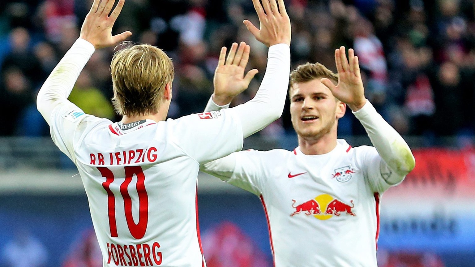 epa05619976 Leipzig&#039;s Emil Forsberg (L) and Timo Werner celebrate the 3:0 goal by Werner during the Bundesliga soccer match between RB Leipzig and FSV Mainz 05 at the Red Bull Arena in Leipzig, G ...