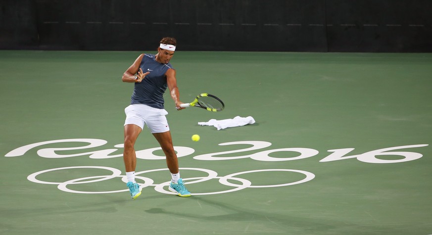 epa05452345 Rafael Nadal of Spain performs during his training session prior to the Rio 2016 Olympic Games Tennis events at the Olympic Tennis Centre in the Olympic Park in Rio de Janeiro, Brazil, 02  ...