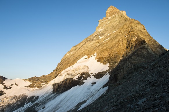 Sunrise on the peak of the Matterhorn moutain with the view from the terrace in front of the the new renovated Hoernli hut which will be inaugurated today, Tuesday, Switzerland, Tuesday, July 14, 2015 ...