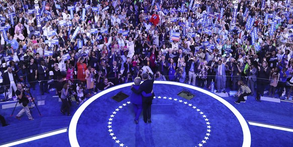 epa05444826 United States President Barack Obama and Democratic Nominee for President Hillary Clinton, wave after addressing the delegates on the third day of the Democratic National Convention at the ...