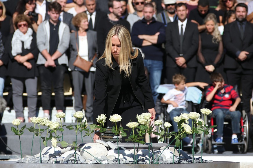 epa05586042 White roses representing each of the 86 victims are placed during the national ceremony to pay tribute to the victims of the 14 July terror attack in Nice, France, 15 October 2016. A total ...