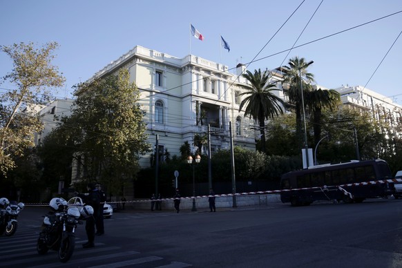 Police stand outside the French embassy, where unidentified attackers threw an explosive device causing a small blast, in Athens, Greece, November 10, 2016. REUTERS/Alkis Konstantinidis TPX IMAGES OF  ...
