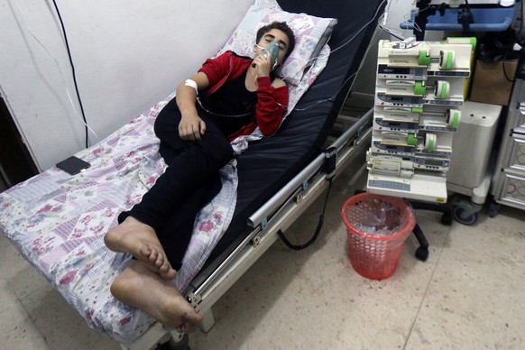 A civilian breathes through an oxygen mask at al-Quds hospital, after a hospital and a civil defence group said a gas, what they believed to be chlorine, was dropped alongside barrel bombs on a neighb ...