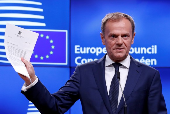 European Council President Donald Tusk shows British Prime Minister Theresa May&#039;s Brexit letter in notice of the UK&#039;s intention to leave the bloc under Article 50 of the EU&#039;s Lisbon Tre ...