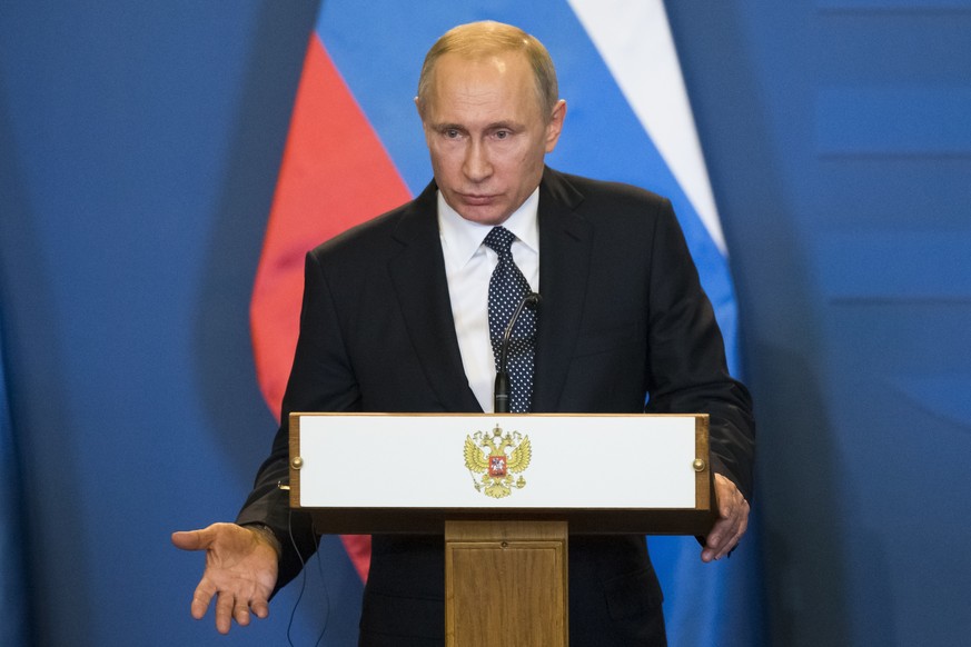 Russian President Vladimir Putin gestures while speaking during his and Hungarian Prime Minister Viktor Orban join news conference at the parliament building in Budapest, Hungary, Thursday, Feb. 2, 20 ...