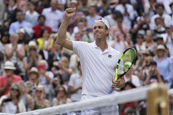 Sam Querrey of the United States celebrates after beating Britain&#039;s Andy Murray at the end of their Men&#039;s Singles Quarterfinal Match on day nine at the Wimbledon Tennis Championships in Lond ...