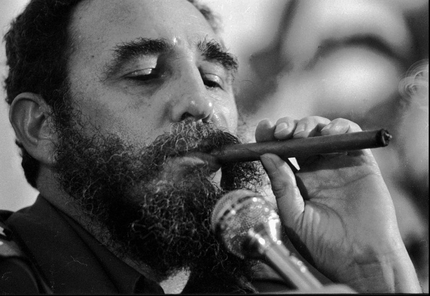 Cuban President Fidel Castro enjoys a cigar in this 1978 photo. Castro, the last remaining communist head of state from the Cold War era, who has ruled Cuba for 42 years, turns 75 on August 13, 2001.  ...