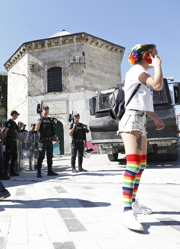 epa06049745 A participant waits in front of Turkish police during the Istanbul LGTB Pride Parade which was cancelled due to security concerns by the governor of Istanbul, in Istanbul, Turkey, 25 June  ...