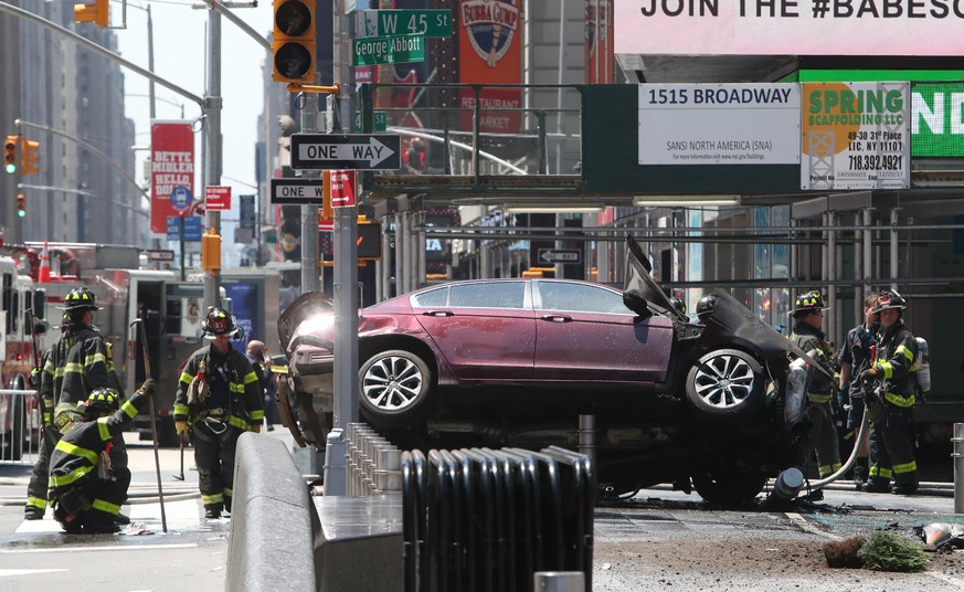 epaselect epa05972524 Emergency workers work at the scene after multiple people were injured when a vehicle struck numerous pedestrians in Times Square in New York City, New York, USA, 18 May 2017. Re ...