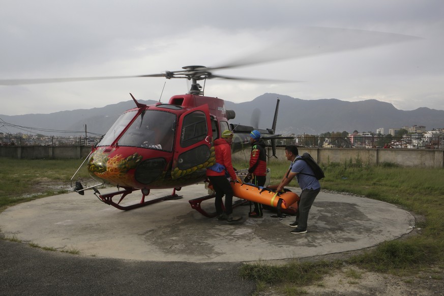 The body of famed Swiss climber Ueli Steck is unloaded from a helicopter at Teaching Hospital in Kathmandu, Nepal, April 30, 2017. 40-year-old Steck, one of the most-renowned mountaineers of his gener ...