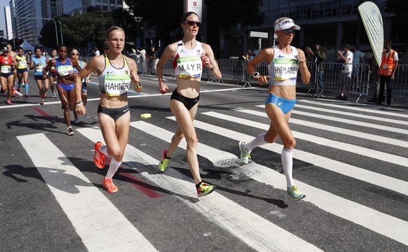 epa05484082 (from left) Lisa Hahner of Germany, Andrea Mayr of Austria and Anne-Mari Hyrylainen of Finland compete in the women&#039;s Marathon race of the Rio 2016 Olympic Games Athletics, Track and  ...