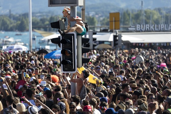 People in the street at the Streetparade in Zurich, Switzerland, on August 29, 2015. The Streetparade is a technoparade and takes place every year on the second Saturday of August. With up to one mill ...