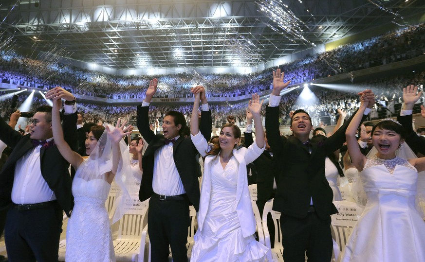 Couples from around the world celebrate after a mass wedding ceremony at the Cheong Shim Peace World Center in Gapyeong, South Korea, Thursday, Sept. 7, 2017. About 4,000 South Korean and foreign coup ...